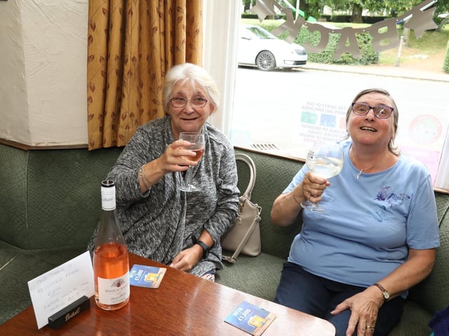 Friends Yve Thomson and Barbara Barnes enjoy a drink together