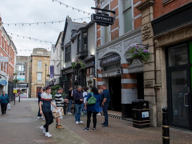 Queues were formed outside some establishments as pubs limit the amount of people they allow in at any one time. Photo: Leila Coker.