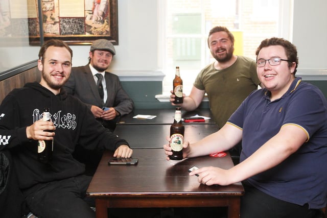 DM2070143a.jpg Pubs in Chichester open after lockdown. The Dolphin and Anchor. From left Kai Thomas-Cussans, Alex Deadman, Callun Battershill and Callum Baker. Photo by Derek Martin Photography
