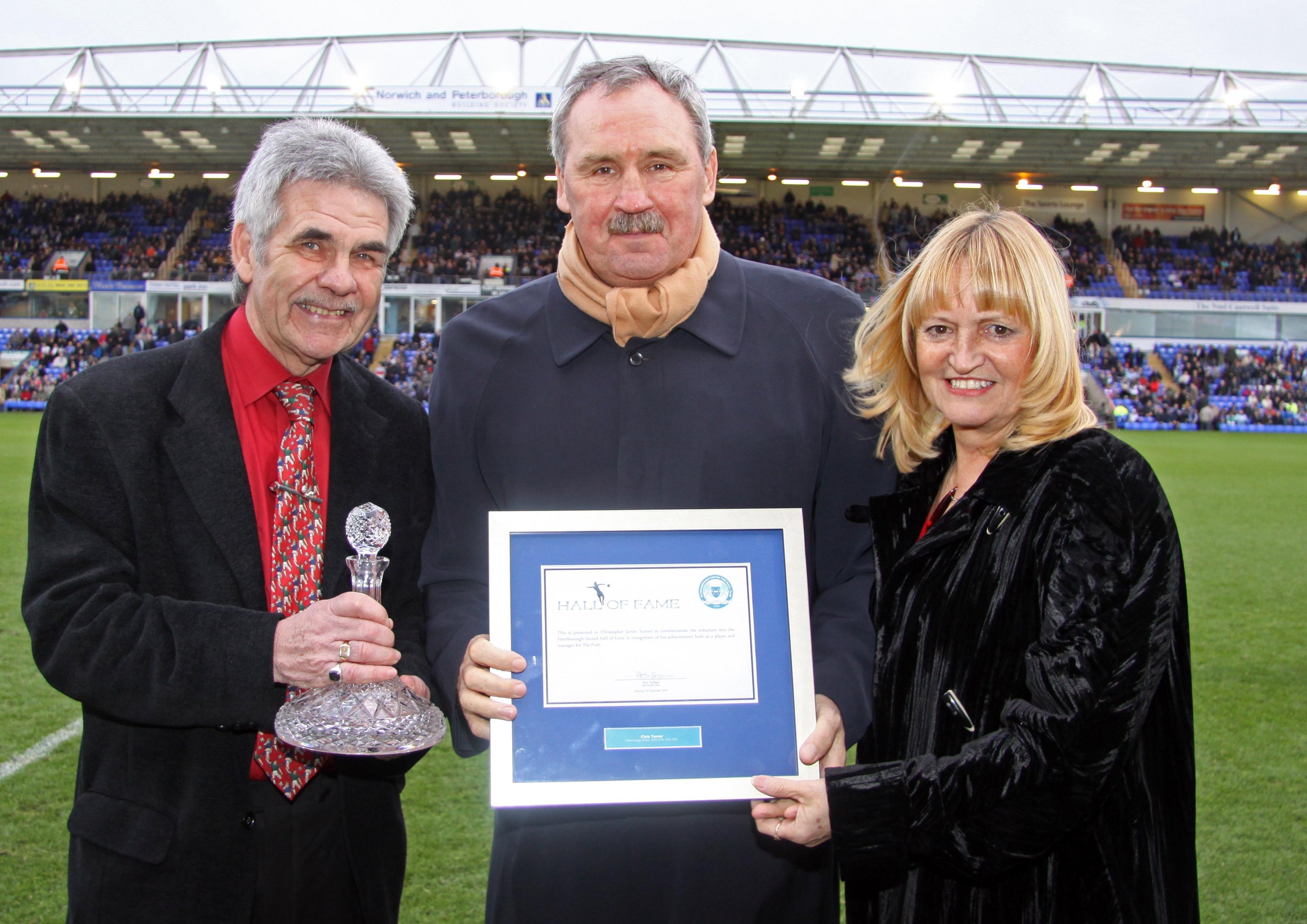 Chris Turner at his Posh Hall of Fame induction flanked by Peter and Sandee Lane.