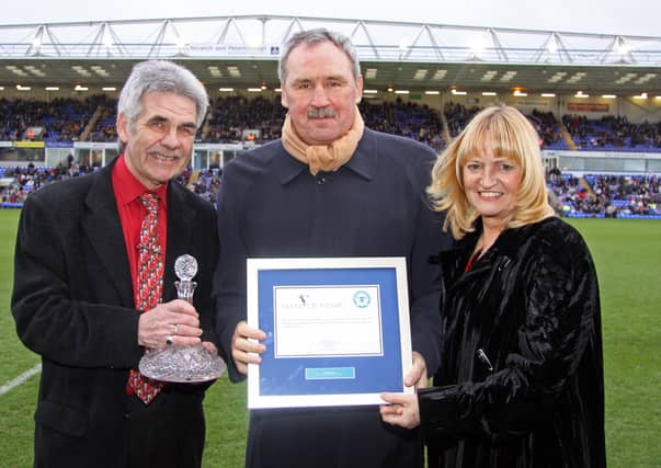 Chris Turner at his Posh Hall of Fame induction flanked by Peter and Sandee Lane.