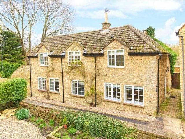 Little Lane, YARDLEY HASTINGS A stone-built 17th century four-bedroom detached house. The property is set in a conservation area and has character features such as exposed timber beams, exposed stone walls, and handmade doors, which have been successfully combined with modern features throughout. The 1,688 sq ftof accommodation includes a dual aspect sitting room which has a feature fireplace with an oak bressumer beam and original bread oven, three window seats, and parquet flooring. Marketed by Michael Graham, Olney