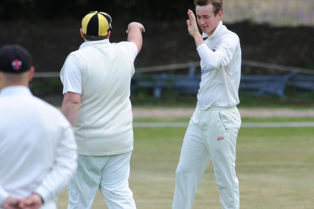 Archie Cairns celebrates a wicket