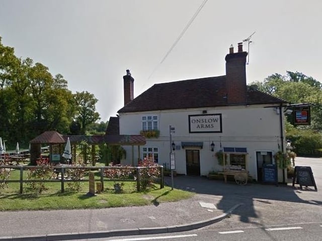 The garden at The Onslow Arms in Loxwood, a 17th-century Grade II-listed building, overlooks the Wey and Arun Canal.
