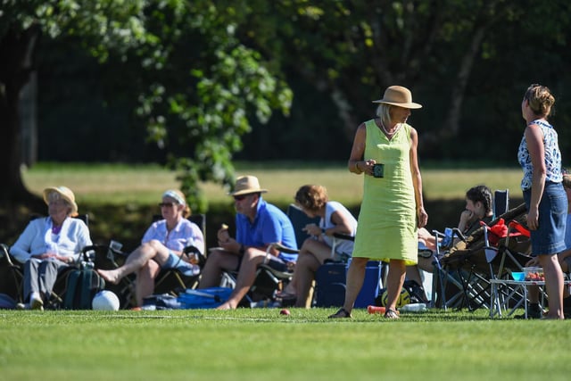 Watching cricket in the sun. West Chiltington v Burgess Hill. Picture by PW Sporting Photography
