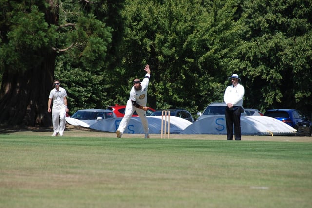 Nick Patterson bowling for Cuckfield. Picture by David Reid