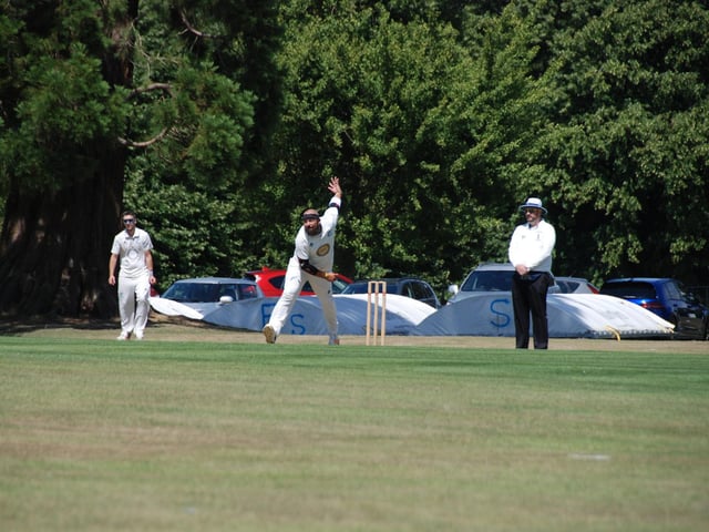 Nick Patterson bowling for Cuckfield. Picture by David Reid