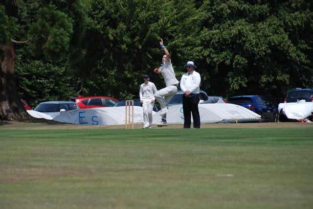 Chris Osbourne bowling for Cuckfield. Picture by David Reid