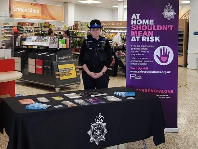 PCSO Kirsty Jackson in Broadbridge Heath, Horsham, raising awareness and offering support for those affected by DA during lockdown, along with photo of her with a DA stand in a supermarket in Horsham.