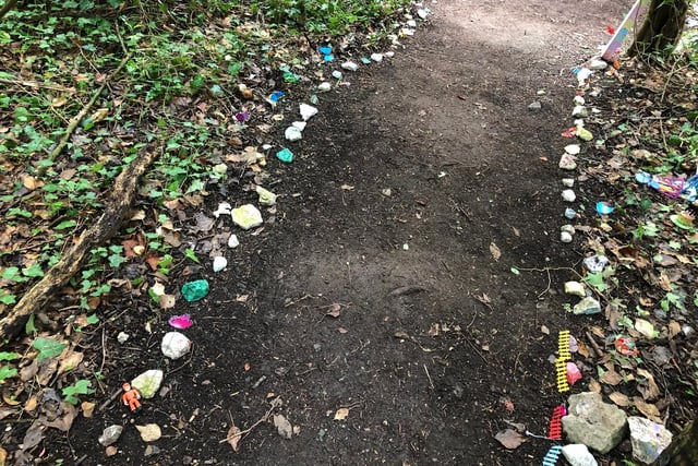The path is lined with toys at the Wendover fairy garden