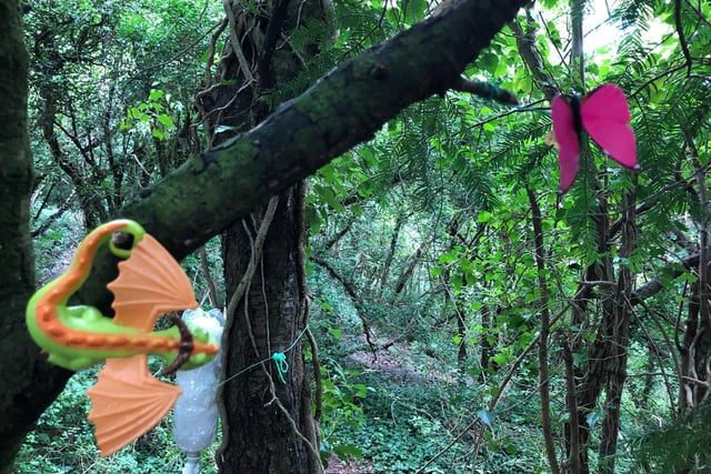 Toys hang from the trees in the Wendover fairy garden