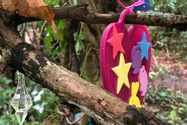 Toys and baubles hang from the trees