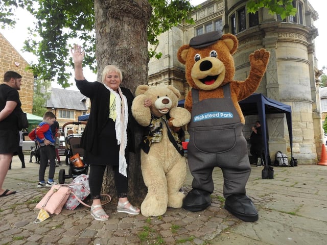 Raffle prize winner June Clifford and her giant bear and Wicky Bear. Photo by Andrew Carpenter