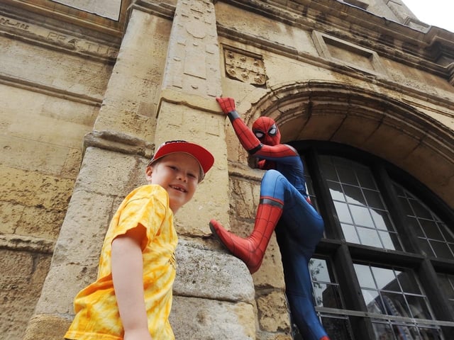 Jacob Owen aged six meets Spiderman during the fundraising event for Wicksteed Park in Rothwell on Saturday. Photo by Andrew Carpenter