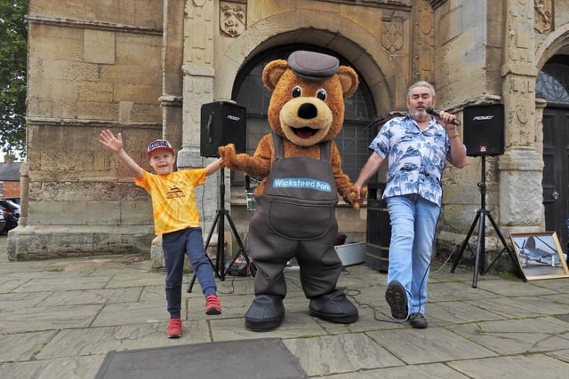 Jacob Owen 6, Wicky Bear and Barry Hale during the fundraiser in Rothwell on Saturday for Wicksteed Park. Photo by Andrew Carpenter