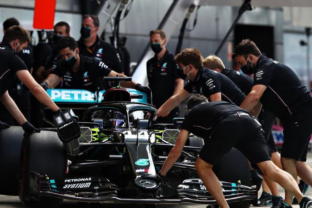 Mechanics from the Brackley-based Mercedes team get to work tweaking a few extra MPH out of Lewis Hamilton's car