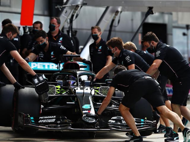 Mechanics from the Brackley-based Mercedes team get to work tweaking a few extra MPH out of Lewis Hamilton's car