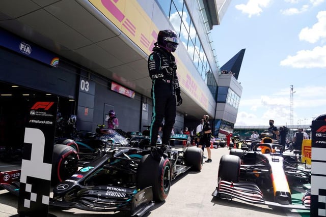 Hamilton shows his delight after his sizzling lap clinched pole for Sunday's British GP