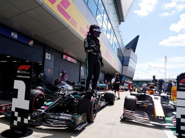 Hamilton shows his delight after his sizzling lap clinched pole for Sunday's British GP