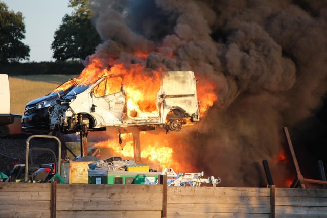 The blaze involved around 40 old vehicles at the Daventry site. Photo: Finbarr Swann