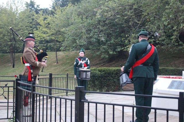 The piping band at the war memorial in Alexandra Park at 6am this morning, to mark VJ Day. SUS-200815-101243001