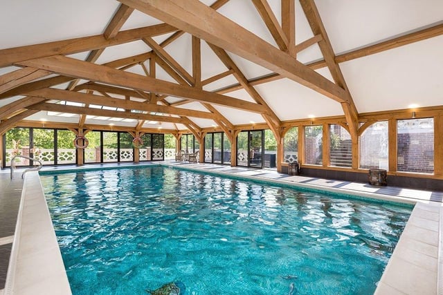Indoor swimming pool with two separate changing rooms with showers, two separate cloakrooms, fitted bar