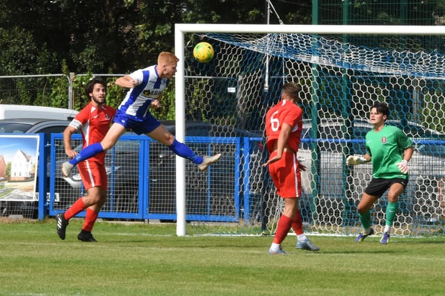 Grahame Lehkyj caught the moment Trevor McCreadie is about to score with a header