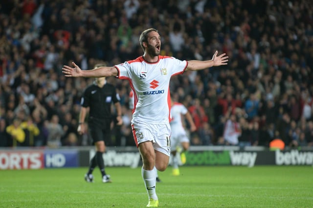 Will Grigg celebrates scoring the first goal of the night