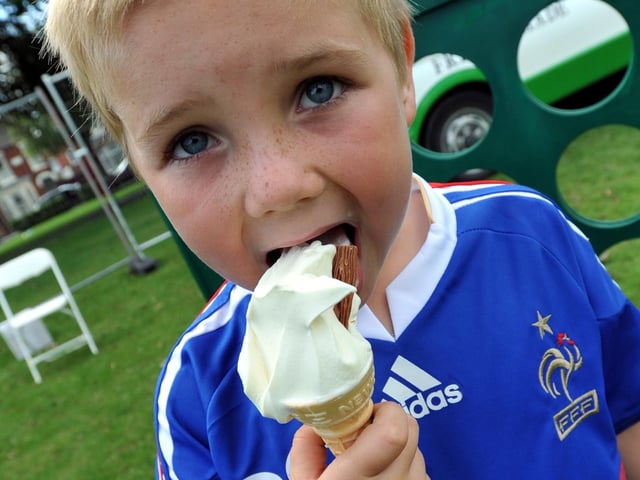 Jack Burgess, seven, tucks into an ice cream.