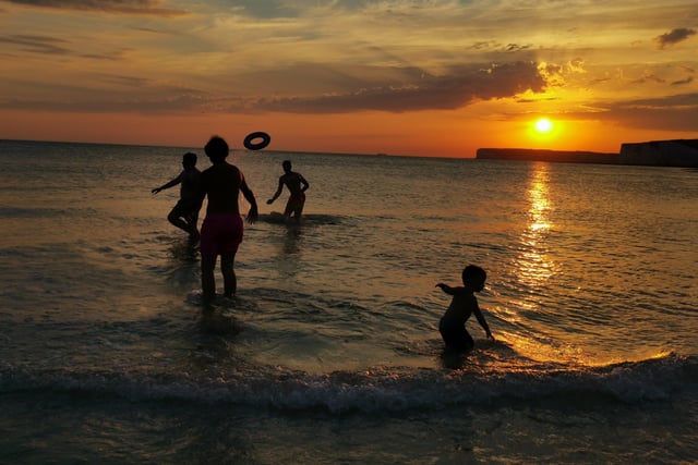 Louise McMullan took this photo of her family playing in the sea at Birling Gap on a fine August sunset. The picture was taken with a p20 Pro mate Huawei. SUS-200209-094351001