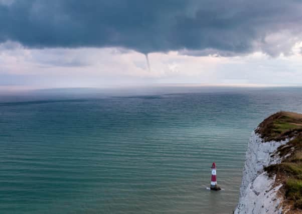 Barry Davis was up on Beachy Head on the evening of Friday August 28 - and took this picture of a rare waterspout off the Eastbourne coast. The picture was taken with a Canon 5D camera. SUS-200209-102124001
