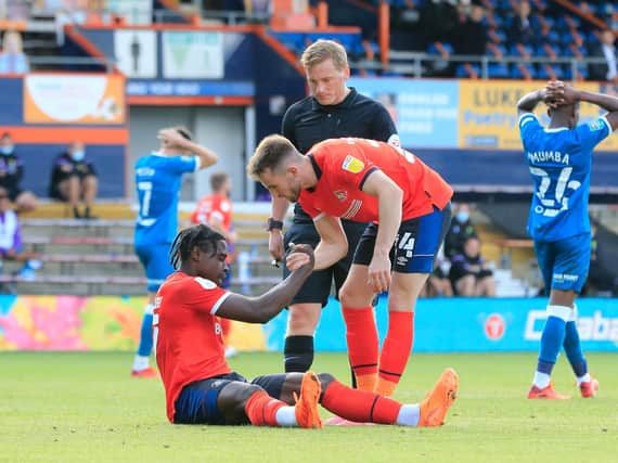 Pelly-Ruddock Mpanzu is congratulated after winning Luton a penalty against Norwich on Saturday