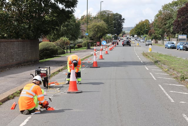 The orange bollards are being installed in Upper Shoreham Road