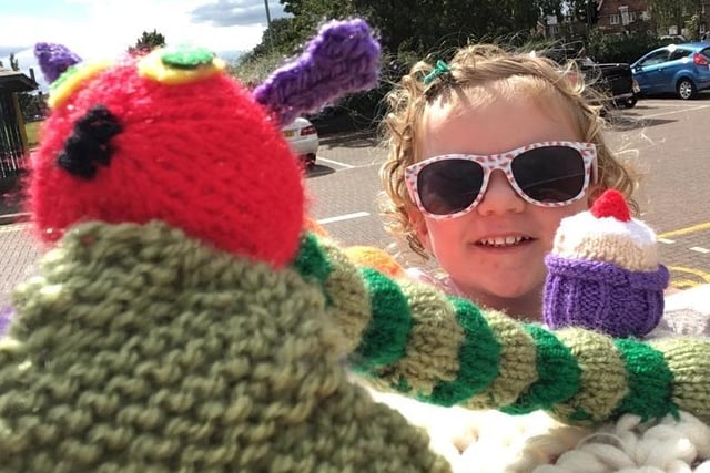 Three-year-old Eva found the Hungry Caterpillar from the knitted postbox topper trail outside Leverstock Green shops