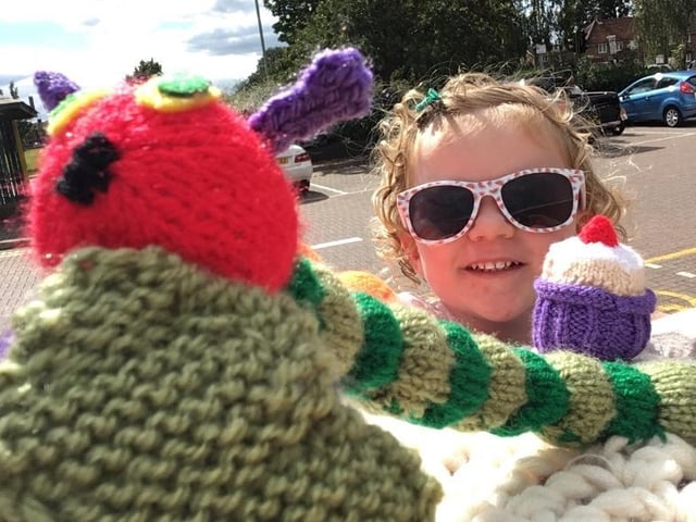 Three-year-old Eva found the Hungry Caterpillar from the knitted postbox topper trail outside Leverstock Green shops