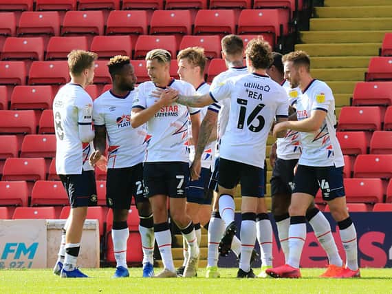Town's players celebrate James Collins' winner at Barnsley on Saturday