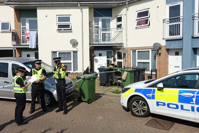 Police standing guard outside the home of Bernadette Walker, 17, at the weekend, whose disappearance is now being treated by police as a "no body" murder. Her parents have appeared in court charged with murder.