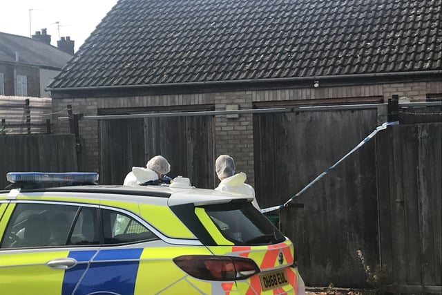 Police searching garages in Walton