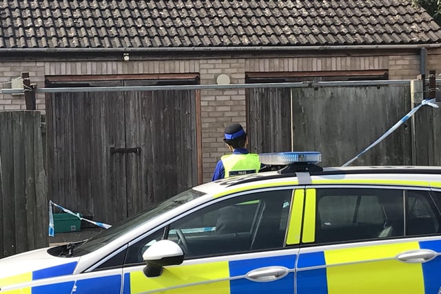 Police searching garages in Walton
