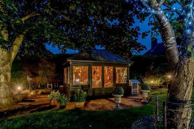 The garden at Meadowbank Lodge includes a summer house. Photo: Fine & Country