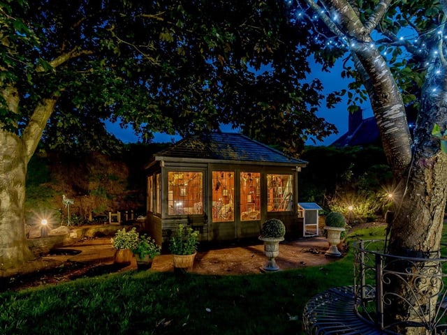 The garden at Meadowbank Lodge includes a summer house. Photo: Fine & Country