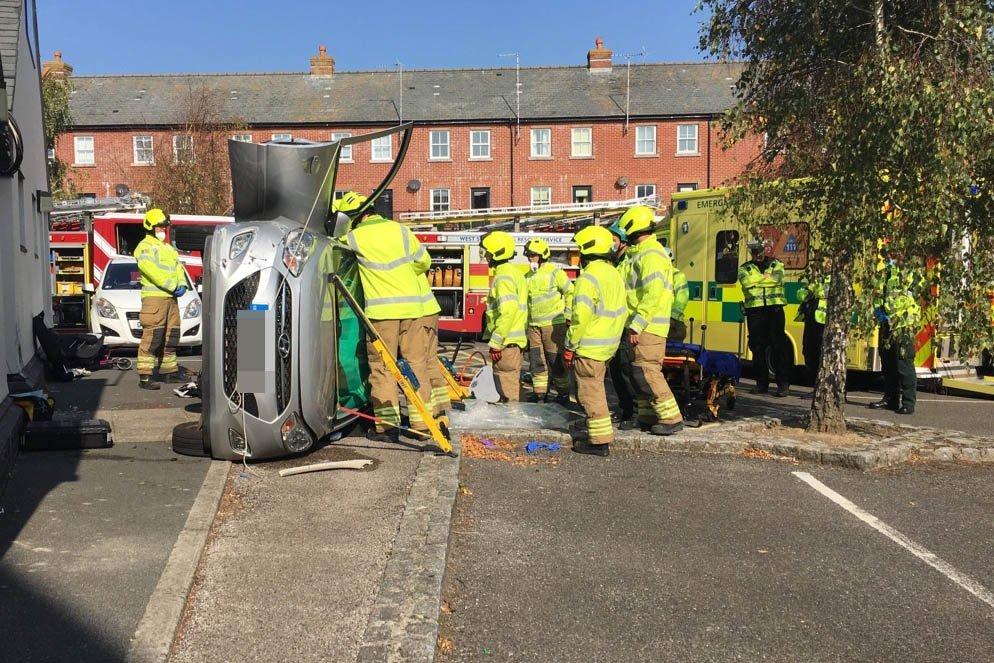 A car has flipped onto its side in the Surrey Street car park in Littlehampton