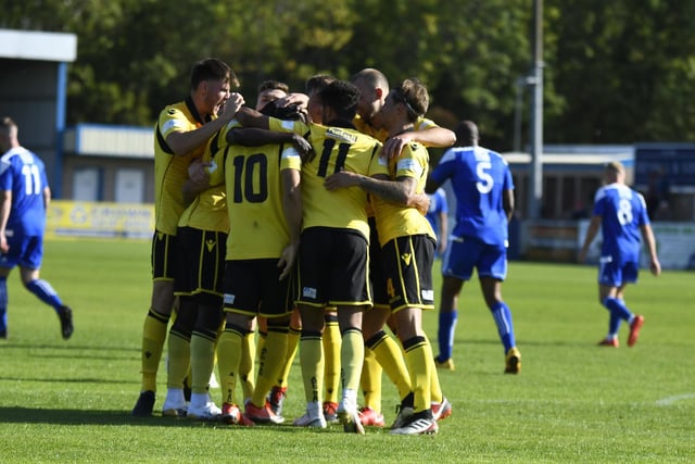 The Diamonds players celebrate the opening goal of the game