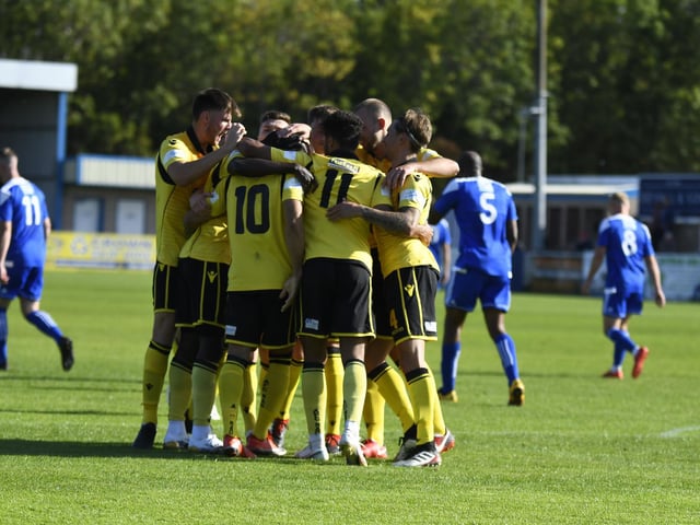 The Diamonds players celebrate the opening goal of the game