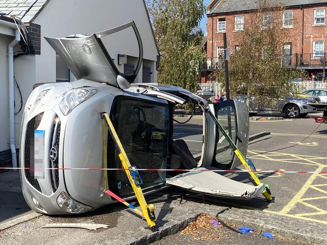 A car has flipped onto its side in the Surrey Street car park in Littlehampton