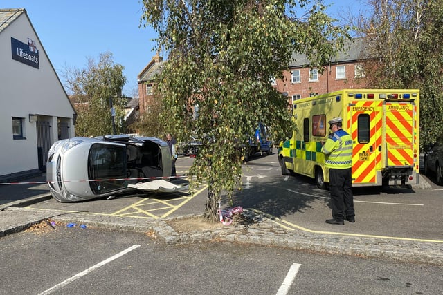 A car has flipped onto its side in the Surrey Street car park in Littlehampton