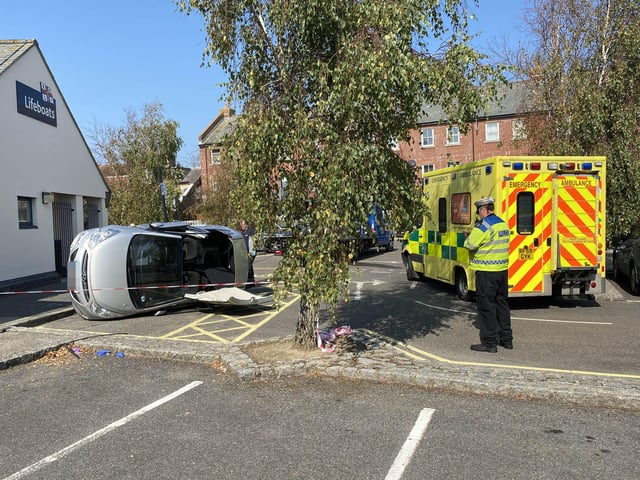 A car has flipped onto its side in the Surrey Street car park in Littlehampton