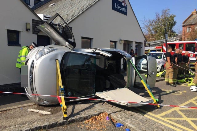 A car has flipped onto its side in the Surrey Street car park in Littlehampton