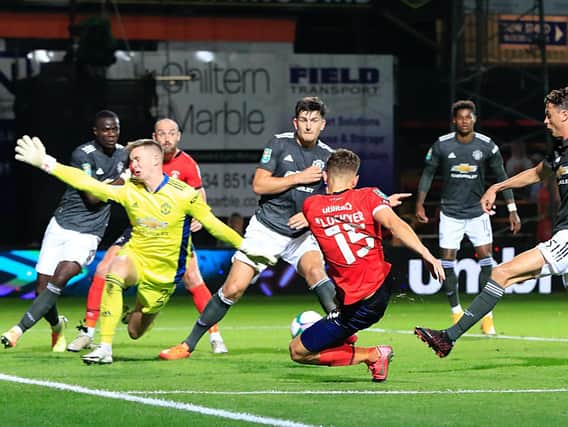 Tom Lockyer goes close to an equaliser against Manchester United last night
