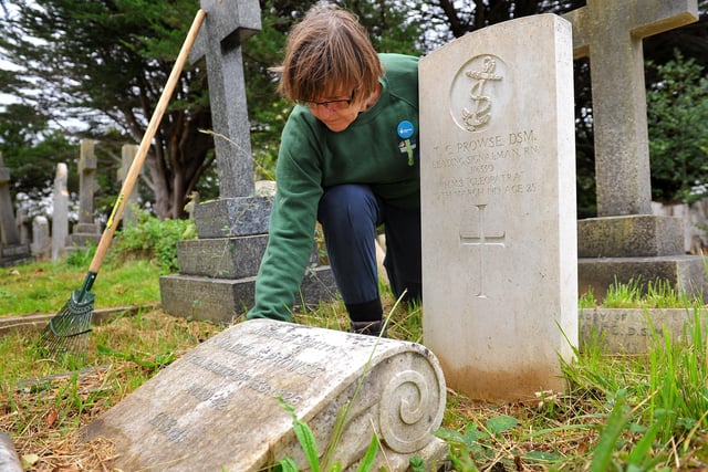 Sue Standing tending the grave of Thomas Prowse and his sister Mabel. Picture: Steve Robards SR2009233